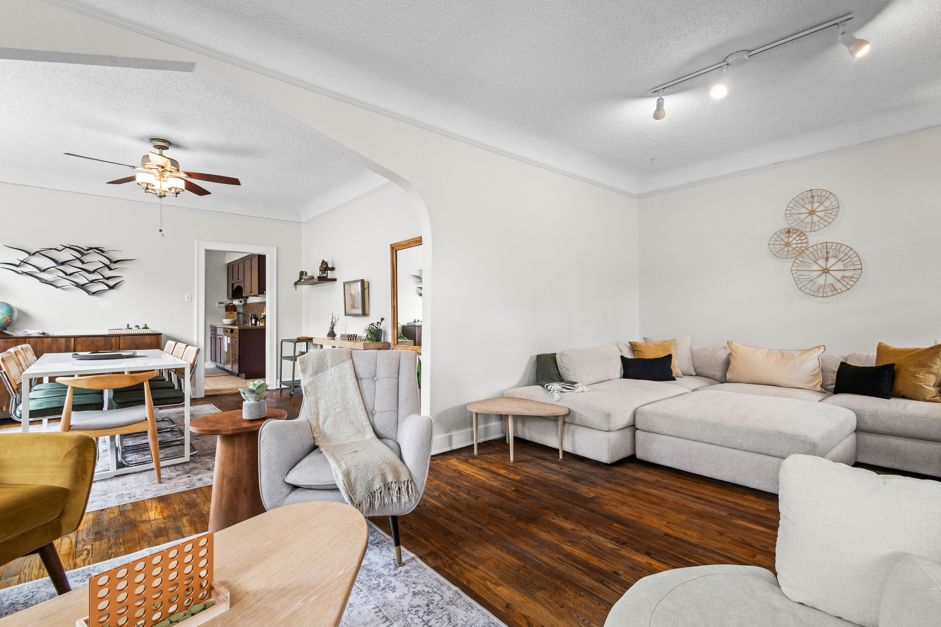 5280 Oasis in Denver — renovated living room with warm desert tones and natural wood accents
